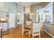 Cozy dining area with bright window views and wood floors and table setting with four chairs at 622 147Th E St, Bradenton, FL 34212