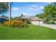 Charming home featuring a well-manicured lawn and lush landscaping, adding to its curb appeal at 622 147Th E St, Bradenton, FL 34212