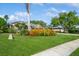 Well-manicured front yard with vibrant landscaping and a charming home, showcasing curb appeal and inviting atmosphere at 622 147Th E St, Bradenton, FL 34212
