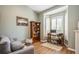 A cozy home office setup with natural light streaming through plantation shutters, perfect for remote work at 622 147Th E St, Bradenton, FL 34212