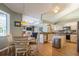 Open-concept kitchen with stainless appliances, granite counters, and adjacent dining space for seamless living at 622 147Th E St, Bradenton, FL 34212