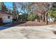 Expansive front yard with mature trees and potential for landscaping at 670 Venice Ln, Sarasota, FL 34242