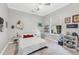 Cozy bedroom with a white bed, themed decor, and a ceiling fan at 7257 Greystone St, Lakewood Ranch, FL 34202