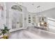 Bright entryway with soaring ceilings, stylish light fixtures, and a clear view into the formal dining area at 7257 Greystone St, Lakewood Ranch, FL 34202