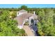 Elegant home exterior featuring a beautifully landscaped entrance, paved driveway, and well-maintained lawn at 7257 Greystone St, Lakewood Ranch, FL 34202