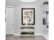 Hallway featuring decor, a console table, modern art, and access to other parts of the home at 7257 Greystone St, Lakewood Ranch, FL 34202