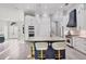 Stylish kitchen with an island, breakfast bar, and stainless steel appliances, creating a modern and functional space at 7257 Greystone St, Lakewood Ranch, FL 34202