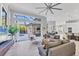 Open living room with sliding doors to the lanai, neutral colors, and an open floor plan at 7257 Greystone St, Lakewood Ranch, FL 34202