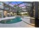 Resort-style pool area with a screened-in lanai, a hot tub, and outdoor seating at 7257 Greystone St, Lakewood Ranch, FL 34202
