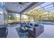 Inviting outdoor space with a pool, lounge chairs, dining area, and a view of the surrounding landscape at 7257 Greystone St, Lakewood Ranch, FL 34202
