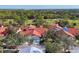 Aerial view of a charming neighborhood with mature trees and well-maintained yards at 7261 Villa D Este Dr, Sarasota, FL 34238
