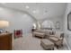 Bright bedroom features neutral décor, plush carpeting, and ample seating, creating a peaceful retreat at 7261 Villa D Este Dr, Sarasota, FL 34238