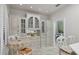 Cozy kitchen features white cabinets, breakfast table, and an adjacent laundry room at 7261 Villa D Este Dr, Sarasota, FL 34238