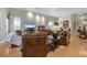 Spacious living room featuring hardwood floors, neutral tones, and elegant furnishings at 7261 Villa D Este Dr, Sarasota, FL 34238