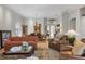 Spacious living room and dining room offer an open layout, hardwood floors, and large windows at 7261 Villa D Este Dr, Sarasota, FL 34238
