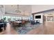 Spacious restaurant area with modern lighting, comfortable seating, and views of the lush landscape at 7261 Villa D Este Dr, Sarasota, FL 34238