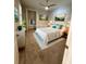Bright bedroom with ceiling fan, closet, and ensuite bath at 7608 Registrar Way, Sarasota, FL 34243