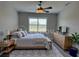Cozy bedroom featuring a large bed, stylish rug, and warm lighting at 7608 Registrar Way, Sarasota, FL 34243