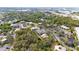 Scenic aerial view of the community nestled among lush trees and a tranquil pond at 9100 Dr Martin Luther King Jr N St # 205, St Petersburg, FL 33702