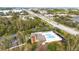 Aerial shot showcases the sparkling pool next to the clubhouse with highway nearby at 9100 Dr Martin Luther King Jr N St # 205, St Petersburg, FL 33702