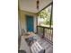 Relaxing outdoor balcony with cozy seating and a view of lush greenery at 9100 Dr Martin Luther King Jr N St # 205, St Petersburg, FL 33702