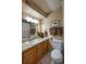 Cozy bathroom with a single sink vanity, warm lighting, and neatly arranged towels at 9100 Dr Martin Luther King Jr N St # 205, St Petersburg, FL 33702