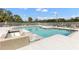 Inviting community pool and hot tub surrounded by comfortable lounge chairs at 9100 Dr Martin Luther King Jr N St # 205, St Petersburg, FL 33702