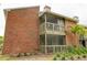 Exterior view of the brick building, showing balconies at 9100 Dr Martin Luther King Jr N St # 205, St Petersburg, FL 33702