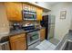 Kitchen featuring stainless steel appliances and light wood cabinets at 9100 Dr Martin Luther King Jr N St # 205, St Petersburg, FL 33702