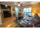 Living room with a leather couch, wood flooring, and sliding glass doors at 9100 Dr Martin Luther King Jr N St # 205, St Petersburg, FL 33702