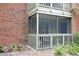 Inviting screened porch with outdoor seating is perfect for relaxing and enjoying the beautiful surroundings at 9100 Dr Martin Luther King Jr N St # 205, St Petersburg, FL 33702