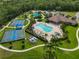 Aerial view of community pool, community center, tennis courts and playground at 1017 Siberian Glen, Bradenton, FL 34212