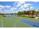 Community basketball court with playground and scenic pond in the background at 1017 Siberian Glen, Bradenton, FL 34212