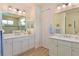 Bathroom with dual vanities, marble countertops, and a neutral color scheme at 1017 Siberian Glen, Bradenton, FL 34212