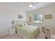 Cozy bedroom with a ceiling fan, neutral carpet, and a sunny window at 1017 Siberian Glen, Bradenton, FL 34212