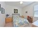 Bedroom with a queen-sized bed, carpet flooring, and a decorative ceiling fan at 1017 Siberian Glen, Bradenton, FL 34212