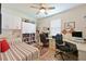 Versatile bedroom with two built-in desks, shelving, and a comfortable sleeping area at 1017 Siberian Glen, Bradenton, FL 34212