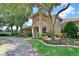Well landscaped clubhouse with trees and an inviting sidewalk at 1017 Siberian Glen, Bradenton, FL 34212