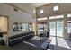 Well-equipped gym with mirrors, weights, and views of the pool at 1017 Siberian Glen, Bradenton, FL 34212