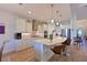 Spacious kitchen featuring stainless steel appliances, stone countertops, and pendant lighting at 1017 Siberian Glen, Bradenton, FL 34212