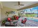 Covered lanai with comfortable seating overlooking the pool and lush landscaping at 1017 Siberian Glen, Bradenton, FL 34212