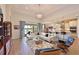 Spacious living room boasts modern furnishings, a plush rug, and a seamless flow into the kitchen and outdoor areas at 1017 Siberian Glen, Bradenton, FL 34212