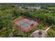 Aerial view of the community tennis courts with a view of the roof of the community center at 1017 Siberian Glen, Bradenton, FL 34212