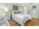 Inviting bedroom with a bed, dresser, and matching nightstands at 1041 Capri Isles Blvd # 232, Venice, FL 34292