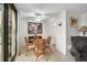 Cozy dining area with a glass table, wicker chairs, and plenty of natural light at 105 Pass Key Rd # 105, Sarasota, FL 34242