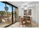 Charming dining area with outdoor views and wicker furniture, perfect for enjoying meals at 105 Pass Key Rd # 105, Sarasota, FL 34242