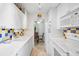Bright kitchen with white cabinets, modern appliances, and an adjoining dining area at 105 Pass Key Rd # 105, Sarasota, FL 34242