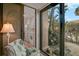 Cozy living room with sliding glass doors to outside and open to a kitchen area at 105 Pass Key Rd # 105, Sarasota, FL 34242