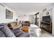 Comfortable living room with cozy seating, tile floors, and sliding glass doors to a balcony at 105 Pass Key Rd # 105, Sarasota, FL 34242