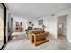 Bright living room with tile flooring and comfortable seating, leading to a dining area at 105 Pass Key Rd # 105, Sarasota, FL 34242